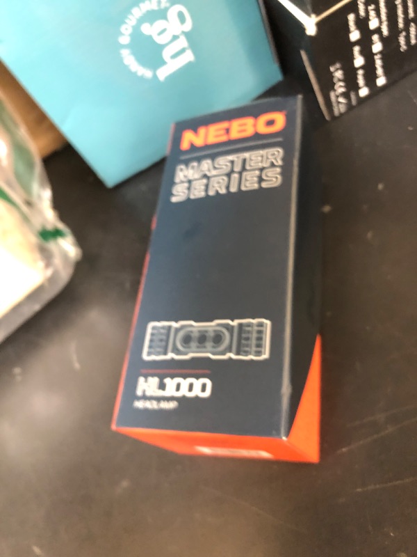 Photo 1 of NEBO Master Series HL1000 LED Headlamp, Rugged and Reliable, Rechargeable, Bright Headlamp with 180 Degree Tilt, 5 Light Modes, Waterproof and Impact Resistant