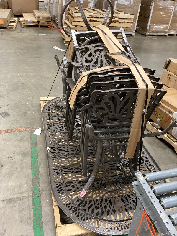 Photo 1 of **It is used and has some broken pieces on the sides of the table and is missing parts.**Homestyles 7 Piece Outdoor Dining Set, Taupe