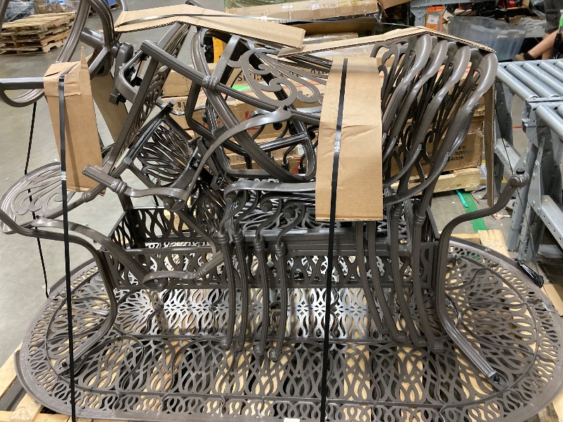 Photo 1 of **It is used and has some broken pieces on the sides of the table and is missing parts.**Homestyles 7 Piece Outdoor Dining Set, Taupe