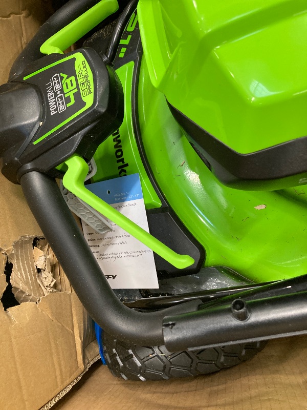 Photo 1 of ***(SELLING AS IS -MISSING PIECES )*** Greenworks 48V (2x24V) 21" Brushless Mower+12" String Trimmer+320CFM Blower,(2) 5.0Ah Batteries and 4A Dual Port Charger  ***(SOME SCUFFS/SCRATCHES, DIRT/GRASS RESIDUE, MISSING PIECES BOX RIPPED/TORN)***