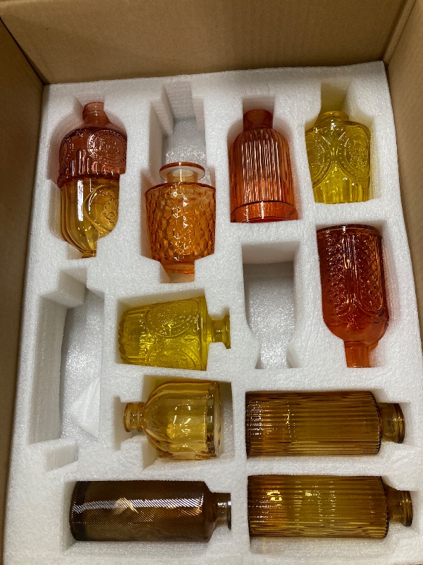 Photo 1 of ***MISSING PARTS - SELLING AS IS*** 
Yaomiao 11 Pcs Vases Bulk Colored Flower Glass Vases Bud Vintage Colored Glass Bottles Colorful Rustic Embossed for Home Wedding Table Decorations Gifts (Orange Yellow Series)