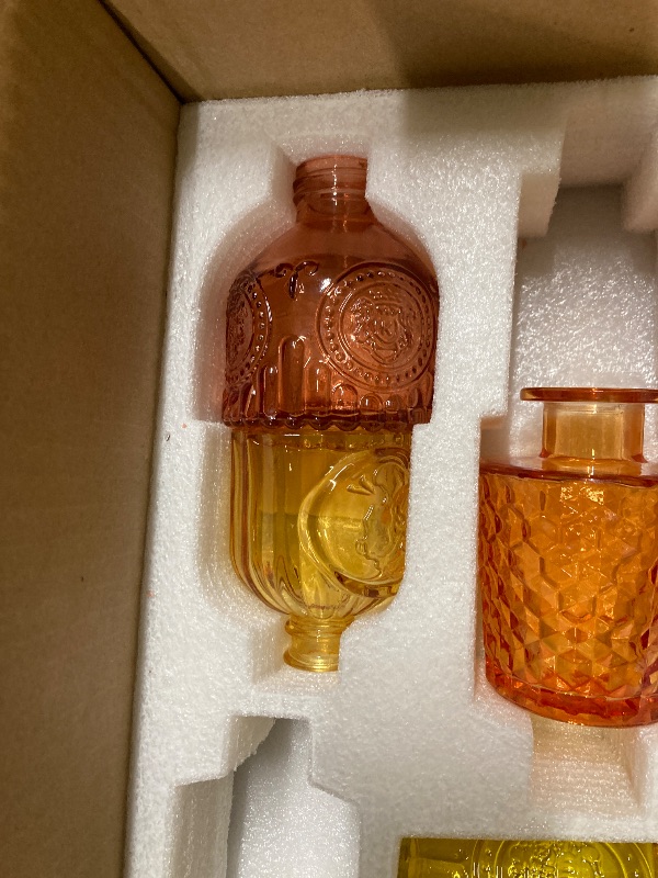 Photo 1 of ***MISSING PARTS - SELLING AS IS*** 
Yaomiao 11 Pcs Vases Bulk Colored Flower Glass Vases Bud Vintage Colored Glass Bottles Colorful Rustic Embossed for Home Wedding Table Decorations Gifts (Orange Yellow Series)