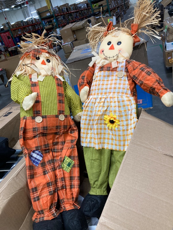 Photo 1 of *used*Worth Imports 33" Standing Boy and Girl, Set of 2 Scarecrow, OrangeYellowGreen