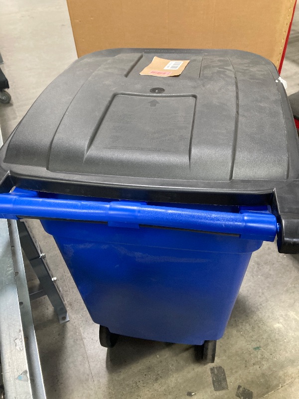 Photo 1 of **PLASTIC BROKE OFF TO HOLD LID ON-SEE PICS**Rubbermaid Commercial Products BRUTE Rollout Heavy-Duty Wheeled Trash/Garbage Can, 32-Gallon, Blue, for Restaurants/Hospitals/Offices/Warehouses/Garage BLUE