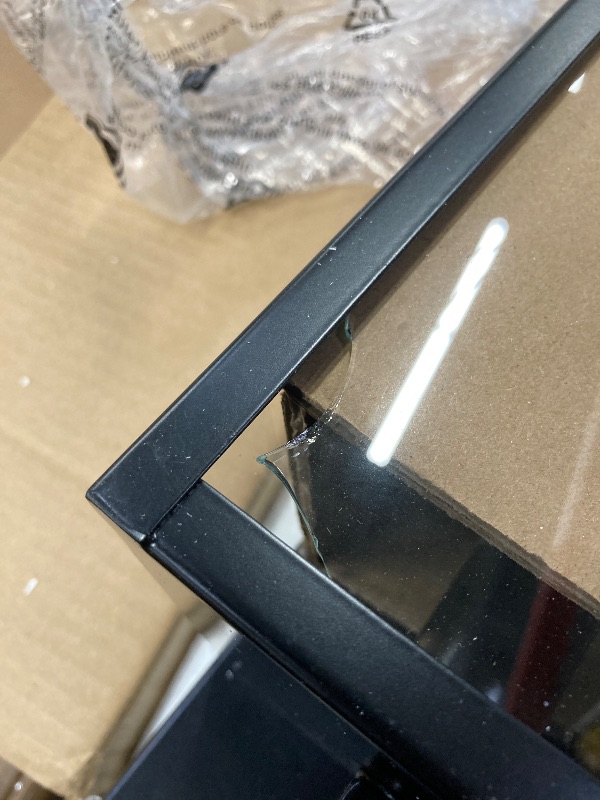 Photo 1 of **On this item, there is broken glass on both of the light post, item is still functional. Please see attached pictures. **

mirrea 11" Classic Outdoor Wall Sconce with Built-in GFCI Outlet 1 Light in Matte Black Rectangular Metal Frame and Clear Glass Sh