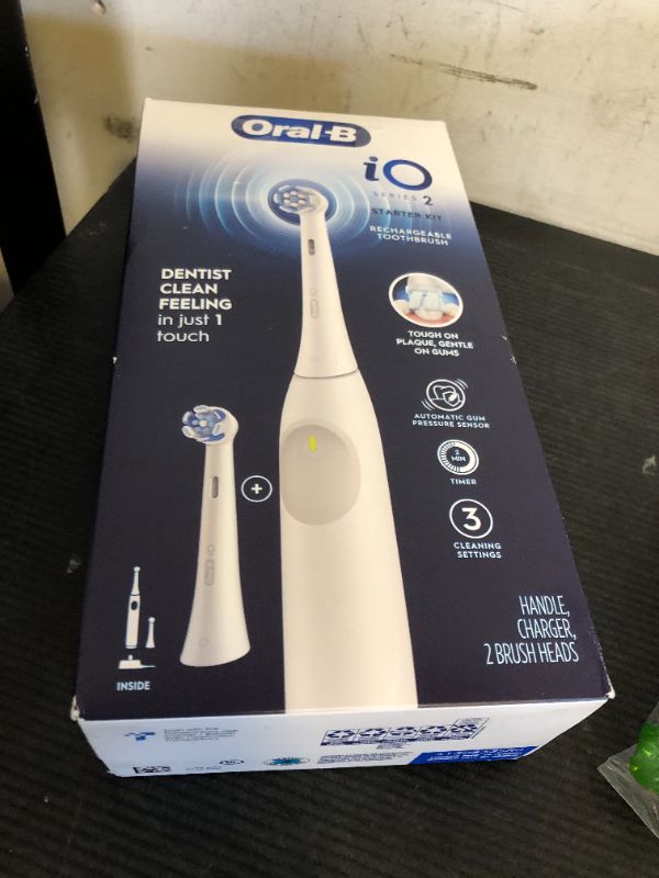 Photo 1 of Oral-B iO Series 2 Rechargeable Electric Powered Toothbrush Starter Kit, Pure White with 2 Brush Heads - Automatic Pressure Sensor to Protect Gums - 3 Modes - 2 Min Timer