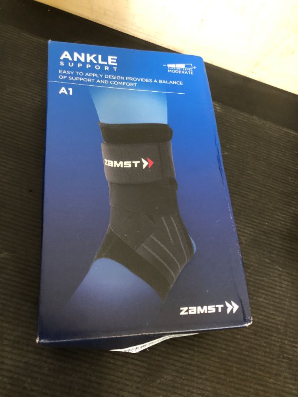 Photo 1 of Zamst A1 Black Ankle Brace for Sports - Breathable Sports Ankle Support for Men and Women with Adjustable Three Way Straps for Moderate Lateral Ankle Sprain - Right, Medium