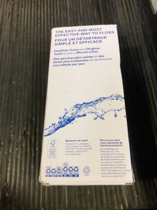 Photo 1 of Waterpik Cordless Pulse Rechargeable Portable Water Flosser for Teeth, Gums, Braces Care and Travel with 2 Flossing Tips, Waterproof, ADA Accepted, WF-20 White, Packaging May Vary
