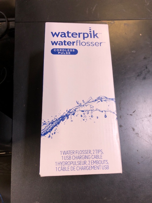 Photo 1 of Waterpik Cordless Pulse Rechargeable Portable Water Flosser for Teeth, Gums, Braces Care and Travel with 2 Flossing Tips, Waterproof, ADA Accepted, WF-20 White, Packaging May Vary
