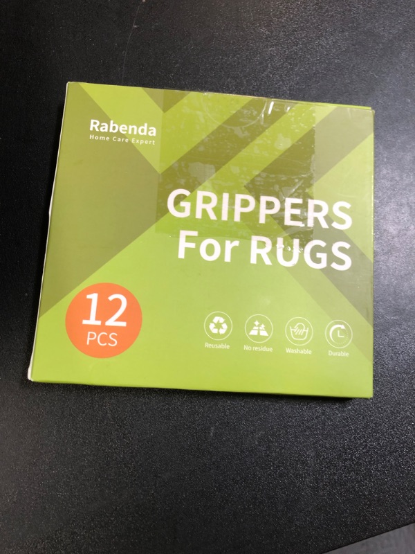 Photo 1 of Rabenda 12 Pcs Rug Tape, Non Slip Rug Pads Grippers for Hardwood Floors and Tiles, Reusable Carpet Tape for Area Rugs, Double-Sided Adhesive Rug Stickers Keep Corners Flat (Black)
