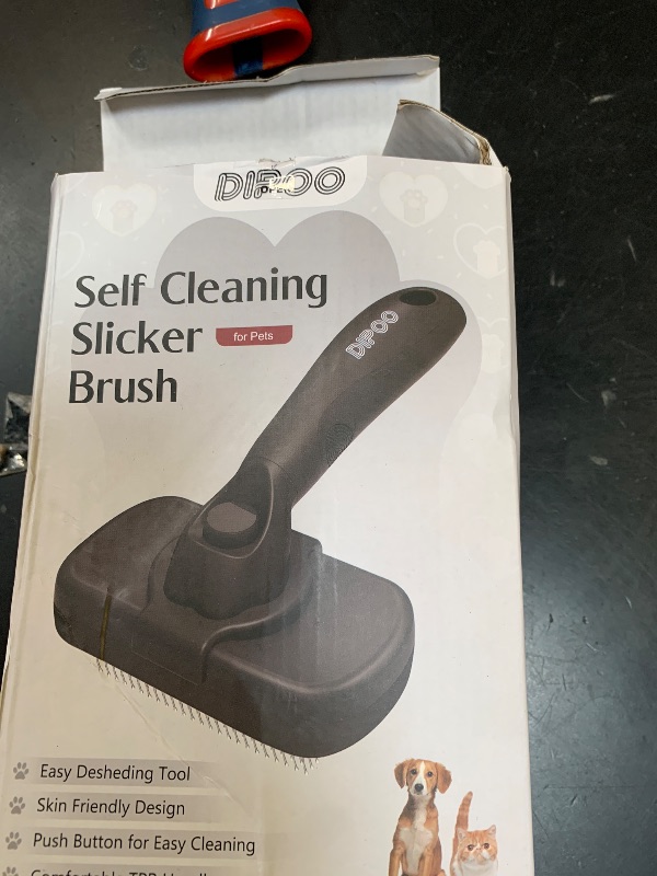 Photo 1 of Dipoo Self Cleaning Shedding Brush - Skin Friendly Grooming Tool for Dogs, Cats, and Puppies, Deshedding and Hair Removal for Long and Short Haired Pets, Black
