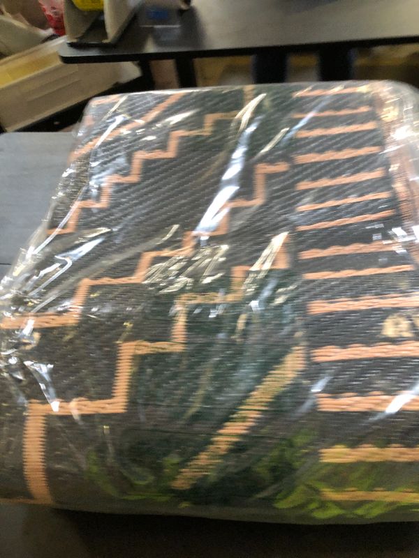 Photo 1 of Wonnitar Waterproof 6x9 Outdoor Rug for Patio Clearance, Reversible Plastic Straw Rug Large Portable Camping RV Rug, Moroccan Outside Area Rug for Backyard Balcony Garden (Black & Brown,6'x9')