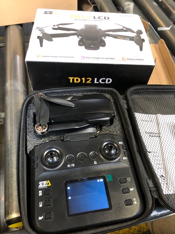 Photo 1 of Toladrone TD12LCD Drone with Camera, Foldable RC Drone with LCD Screen Remote Control Brushless Motor Dron Optical Flow Positioning Drones for Adults Quadcopter for Beginners