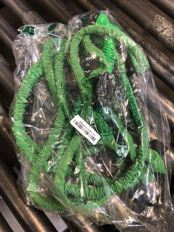 Photo 1 of Expandable Garden Hose 50FT Pipe, Flexible Water Hose with 7 Function Spray Nozzle, Durable Garden Hoses for Gardening Lawn Car Pet Cleaning, Green