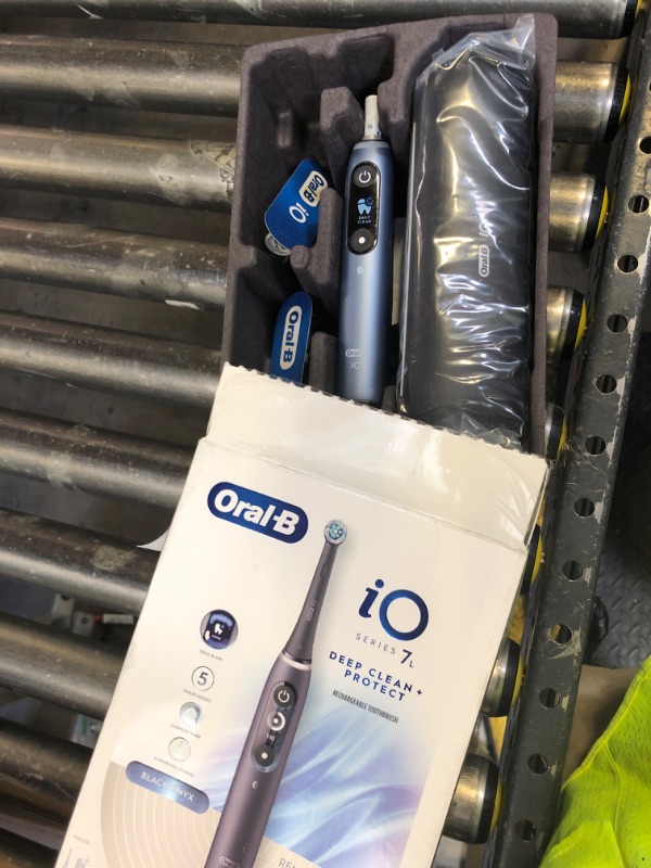 Photo 1 of Oral-B iO Deep Clean + Protect Rechargeable Electric Toothbrush, Black with a iO Series 7 Toothbrush, 2 Replacement Brush Heads, and a Charging Travel Case