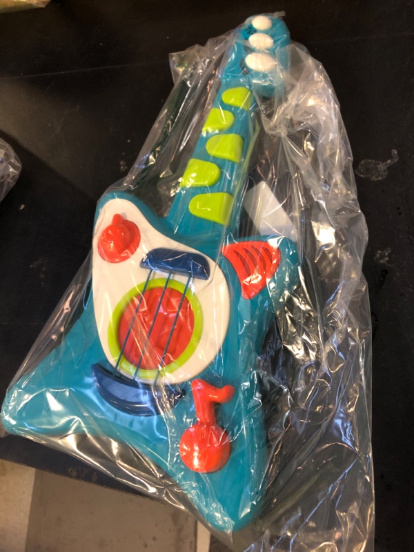 Photo 1 of Battat- Toy Guitar For Toddlers, Kids, Children – Play Guitar With Songbook – Acoustic, Electric, And Song Modes- Lil' Rocker's Guitar – 2 Years +