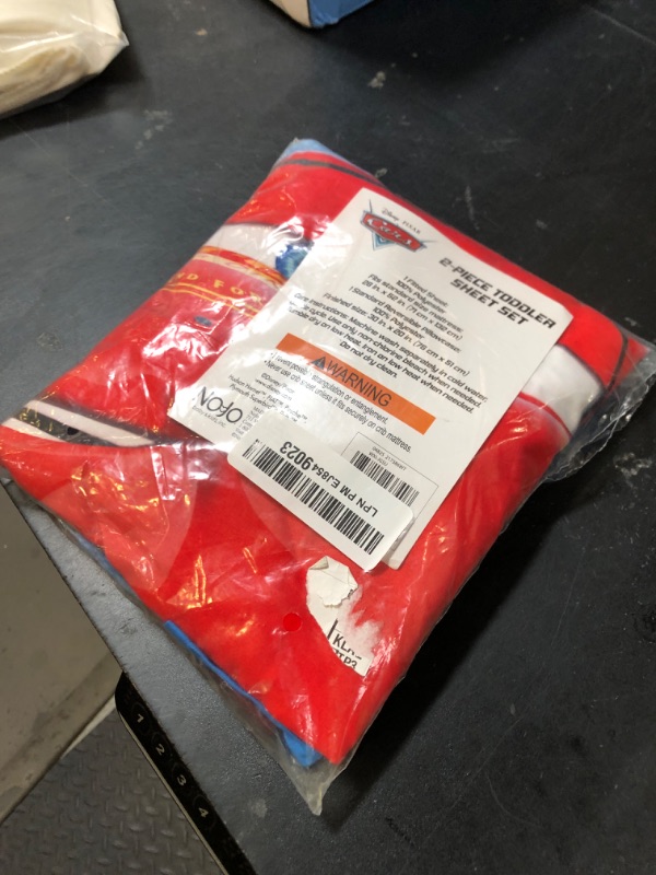 Photo 1 of Disney Cars Radiator Springs White, Blue, and Red Lightning McQueen and Tow-Mater 2 Piece Toddler Sheet Set - Fitted Bottom Sheet and Reversible Pillowcase