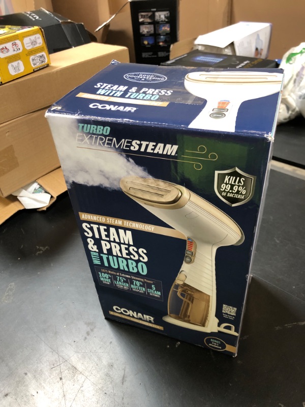 Photo 1 of Conair Handheld Garment Steamer for Clothes, Turbo ExtremeSteam 1875W, Portable Handheld Design, Strong Penetrating Steam, White / Champagne
