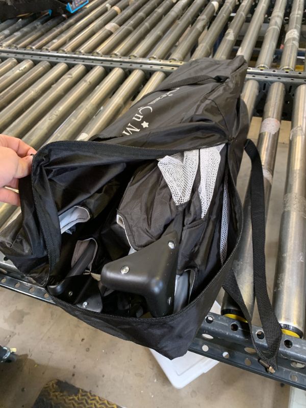 Photo 1 of Dream On Me Nest Portable Playard in Black with Carrybag an Shoulder Strap, Lightweight, Packable and Easy Setup Baby Playard, Breathable Mesh Sides and Soft Fabric - Comes with a Removable Padded Mat