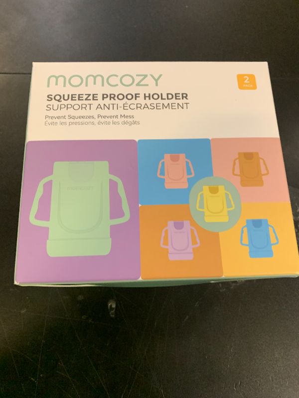 Photo 1 of Momcozy Squeeze Pouch Holder for Food Pouches and Drink Boxes, Baby Pouch Holder Allows Baby to Self-feed and Avoid Messes, Baby Food Pouch Holder Handle is Easy to Grip, Comfortable, Violet&Orange