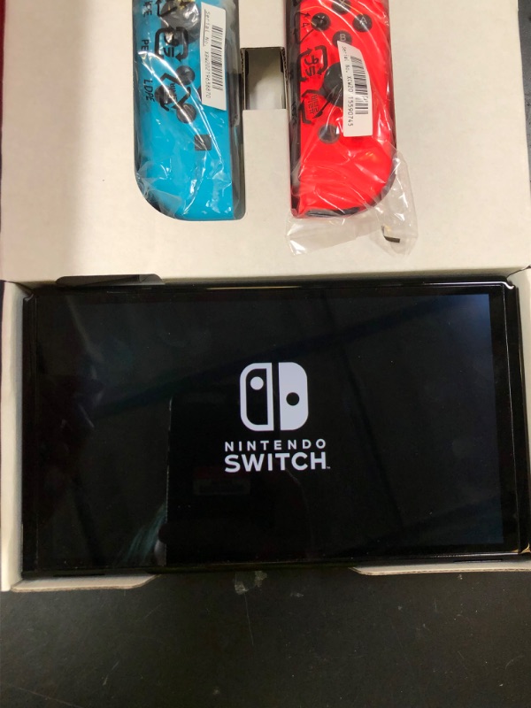 Photo 1 of Nintendo Switch – OLED Model w/ Neon Red & Neon Blue Joy-Con