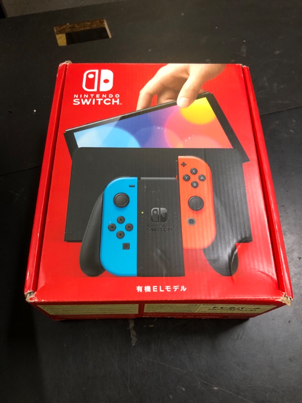 Photo 1 of Nintendo Switch – OLED Model w/ Neon Red & Neon Blue Joy-Con