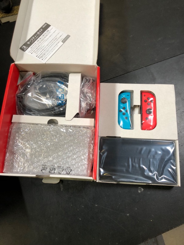 Photo 1 of Nintendo Switch – OLED Model w/ Neon Red & Neon Blue Joy-Con