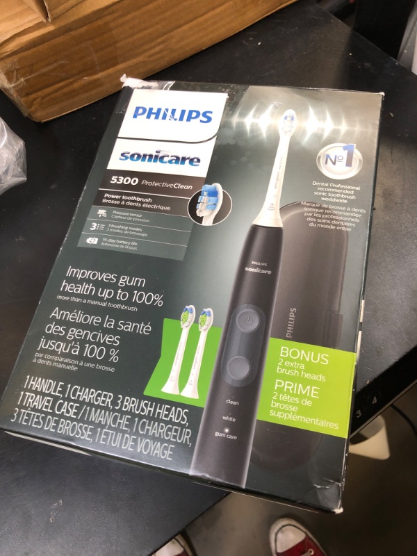 Photo 1 of Philips Sonicare ProtectiveClean 5300 Rechargeable Electric Toothbrush, with Pressure Sensor, 3 Cleaning Modes, SmarTimer and QuadPacer, with 2 Bonus Brush Heads, Travel Case, Black, Model HX6423/34