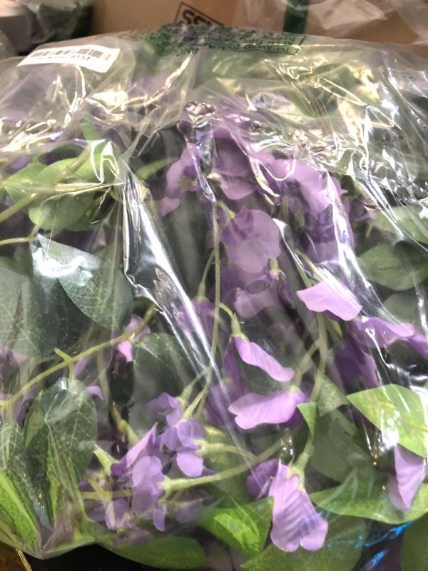 Photo 1 of Lvydec Wisteria Artificial Flowers Garland, 4 Pcs Total 28.8ft Artificial Wisteria Vine Silk Hanging Flower for Home Garden Outdoor Ceremony Wedding Arch Floral Decor (Light Purple)