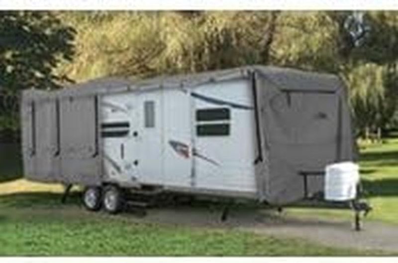 Photo 1 of Camco ULTRAGuard 28-30-Ft Travel Trailer/Class C RV Cover - Features Zipper Entry Doors & Covered Air Vents - Crafted of Spunbond Polypropylene - Storage Bag for RV Storage and Organization (45744)

