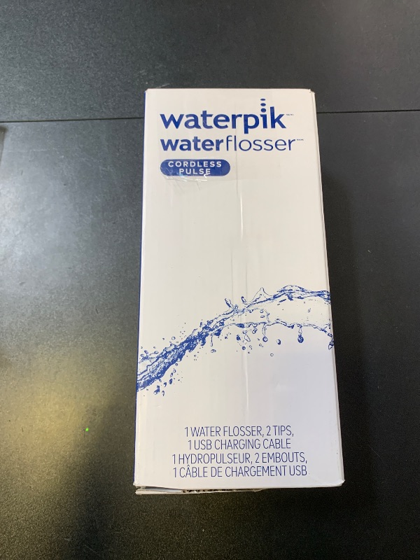 Photo 1 of Waterpik Cordless Pulse Rechargeable Portable Water Flosser for Teeth, Gums, Braces Care and Travel with 2 Flossing Tips, Waterproof, ADA Accepted, WF-20 White, Packaging May Vary