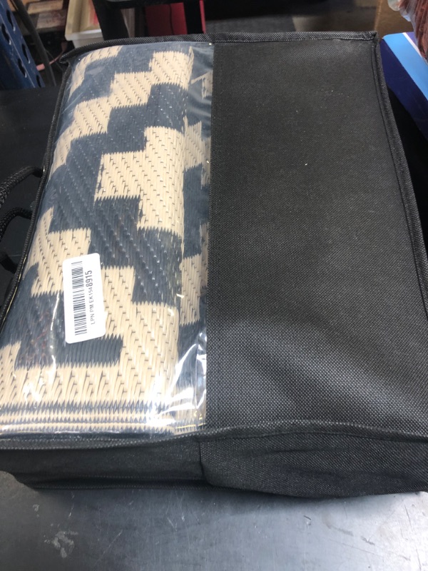 Photo 1 of Smiry Waterproof Outdoor Rug 5x8 ft, Reversible Plastic Straw Patio Camping Rugs, Outdoor Indoor RV Mat Carpet for Patio, Outside Entry, Backyard, Deck, Bench, Picnic, Camper, Black & Beige