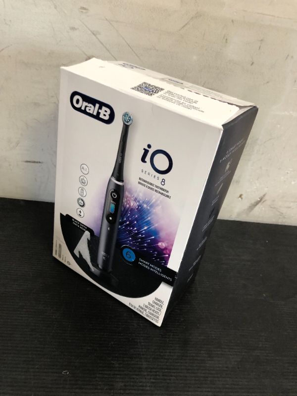 Photo 1 of Oral-B iO Series 8 Electric Toothbrush with 2 Replacement Brush Heads and Travel Case, Rechargeable Toothbrush, Black Onyx