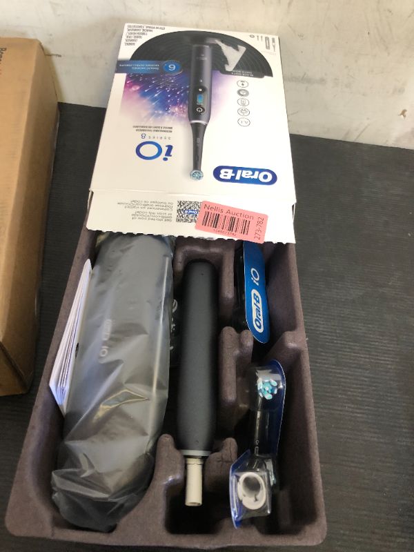 Photo 1 of Oral-B iO Series 8 Electric Toothbrush with 2 Replacement Brush Heads and Travel Case, Rechargeable Toothbrush, Black Onyx