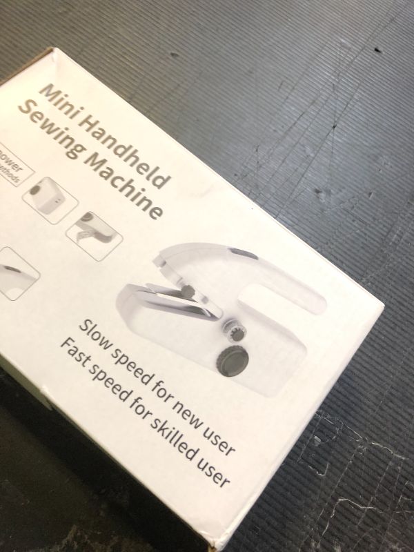 Photo 1 of Handheld Sewing Machine,Two dear,Mini sewing machine,Easy to Use and Fast Stitch Suitable for Clothes,Fabrics, DIY Home Travel Electric Handheld Sewing Machine for Beginners.(White)