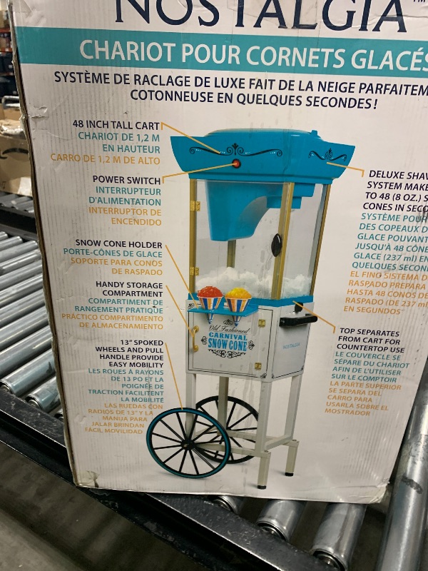 Photo 1 of Nostalgia Snow Cone Shaved Ice Machine - Retro Cart Slushie Machine Makes 48 Icy Treats - Includes Metal Scoop, Storage Compartment, Wheels for Easy Mobility - White, Blue