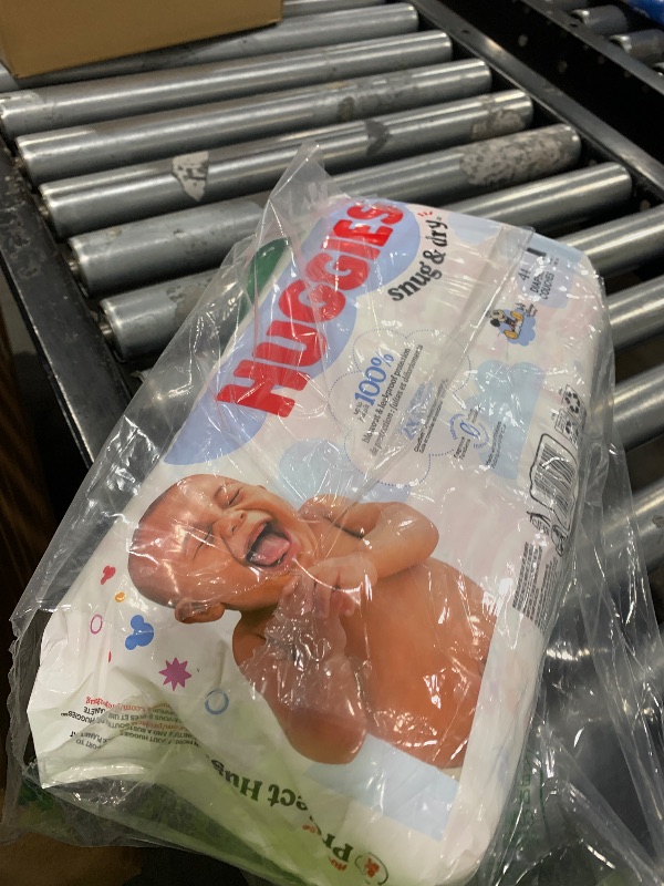 Photo 1 of Huggies Size 1 Diapers, Snug & Dry Newborn Diapers, Size 1 (8-14 lbs), 44 Count, Packaging May Vary