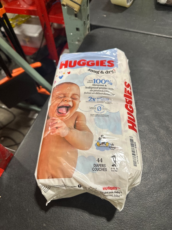 Photo 1 of Huggies Size 1 Diapers, Snug & Dry Newborn Diapers, Size 1 (8-14 lbs), 44 Count, Packaging May Vary