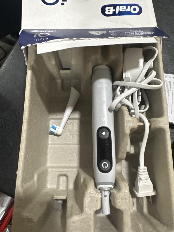Photo 1 of Oral-B iO Series 6 Rechargeable Electric Toothbrush with Visible Pressure Sensor to Protect Gums, 2 Minute Timer, 5 Cleaning Settings, 1 Replacement Toothbrush Head, and Travel Case, Grey Opal
