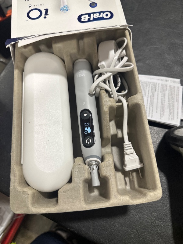 Photo 1 of Oral-B iO Series 6 Rechargeable Electric Toothbrush with Visible Pressure Sensor to Protect Gums, 2 Minute Timer, 5 Cleaning Settings, 1 Replacement Toothbrush Head, and Travel Case, Grey Opal