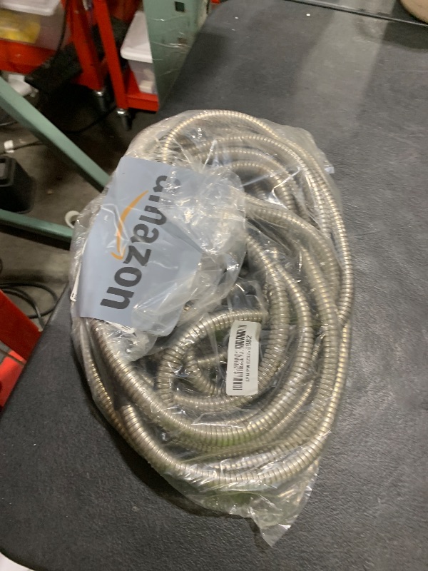 Photo 1 of Metal Garden Hose 25 Ft Flexible Stainless Steel Garden Hose Lightweight, Heavy Duty Water Hose With High Pressure Hose Nozzle Sprayer for Garden, Lawn(25 FT)