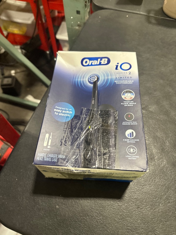 Photo 1 of Oral-B iO Simple Clean Rechargeable Electric Powered Toothbrush, Night Black with 1 Gentle Care Brush Head and 1 Black Travel Case - Automatic Pressure Sensor to Protect Gums - 3 Modes - 2 Min Timer