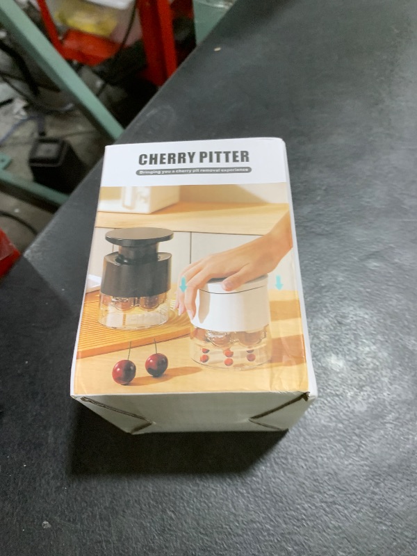 Photo 1 of Cherry Pitter Multiple, Quick Release Multi Cherries Stoner Pitter 7-in-1, Push Button Cherr'y Core Pit'ter Tool with Splatter Protector, Pit Seed Remover for Making Jam Cherry Dishes (Black-7-Hole)