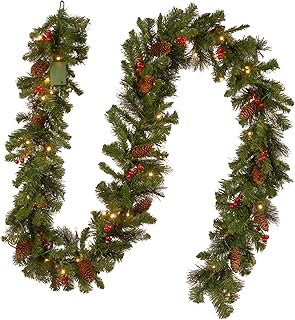 Photo 1 of National Tree Company Pre-Lit Artificial Christmas Garland, Green, Crestwood Spruce, White Lights, Decorated with Glitter, Pinecones, Berry Clusters, Battery Operated, Christmas Collection, 9 Feet