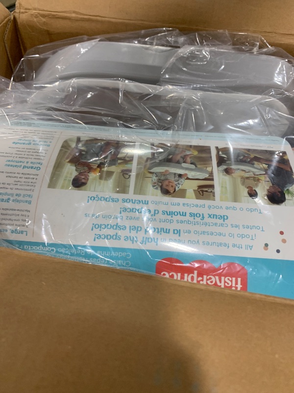 Photo 1 of Fisher-Price SpaceSaver High Chair Navy Foliage, portable infant-to-toddler dining chair and booster seat with easy clean up features