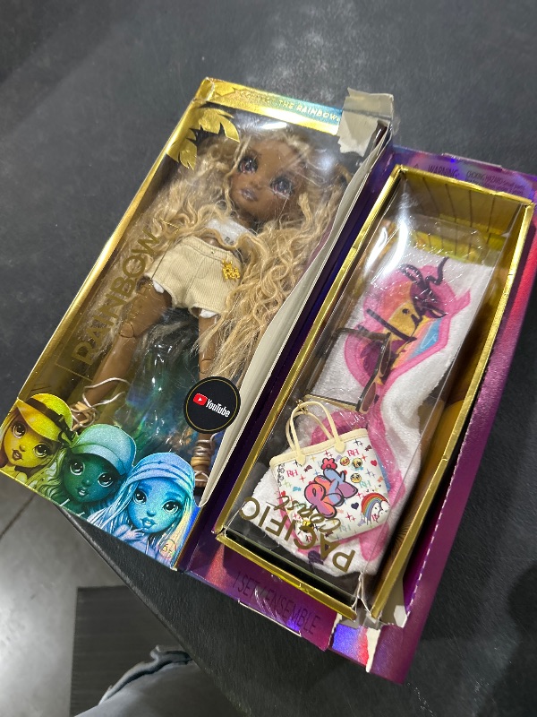 Photo 1 of Rainbow High Pacific Coast Harper Dune- Sand (Light Yellow) Fashion Doll with Outfit, Pool Accessories Playset, Interchangeable Legs, Toys for Kids, Great Gift for Ages 6-12+ Years