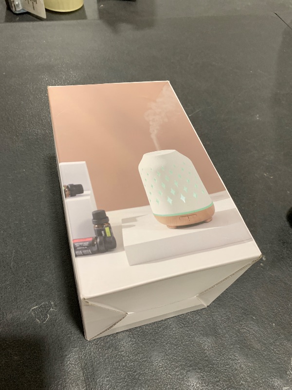 Photo 1 of InnoGear Aromatherapy Diffuser, 150ml Ceramic Diffuser Ultrasonic Humidifier Cool Mist Essential Oil Diffusers for Home Air Diffuser with 2 Mist Modes Waterless Auto Off, White