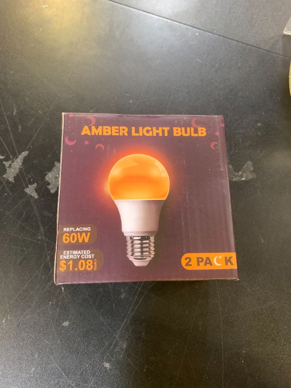 Photo 1 of DALUXshop Amber Sleep Light Bulbs, Blue Light Blocking, A19 9W(60 Watt Equivalent) Dim Light Bulbs for Lamp, 1800K Warm Light Bulb, E26 for Healthy Sleep, Bedroom, Kids Room, 2 Pack