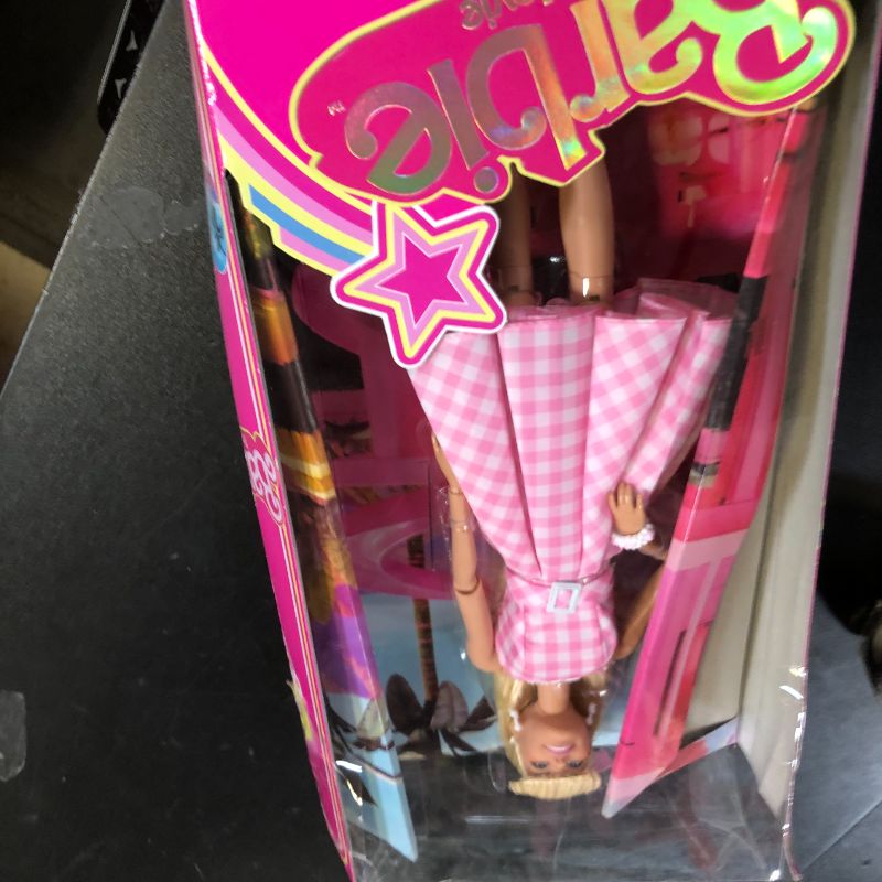 Photo 1 of Barbie The Movie Doll, Margot Robbie as, Collectible Doll Wearing Pink and White Gingham Dress with Daisy Chain Necklace