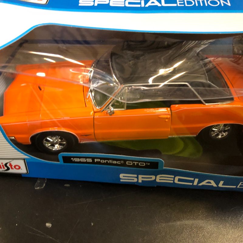 Photo 1 of Maisto 1:18 Scale 1965 Pontiac GTO (Hurst Edition) Diecast Vehicle (Colors May Vary)